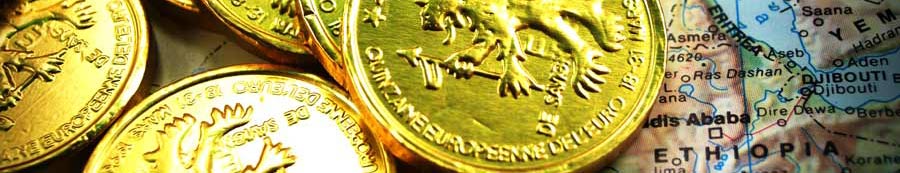 moedas de ouro e mapas de economia